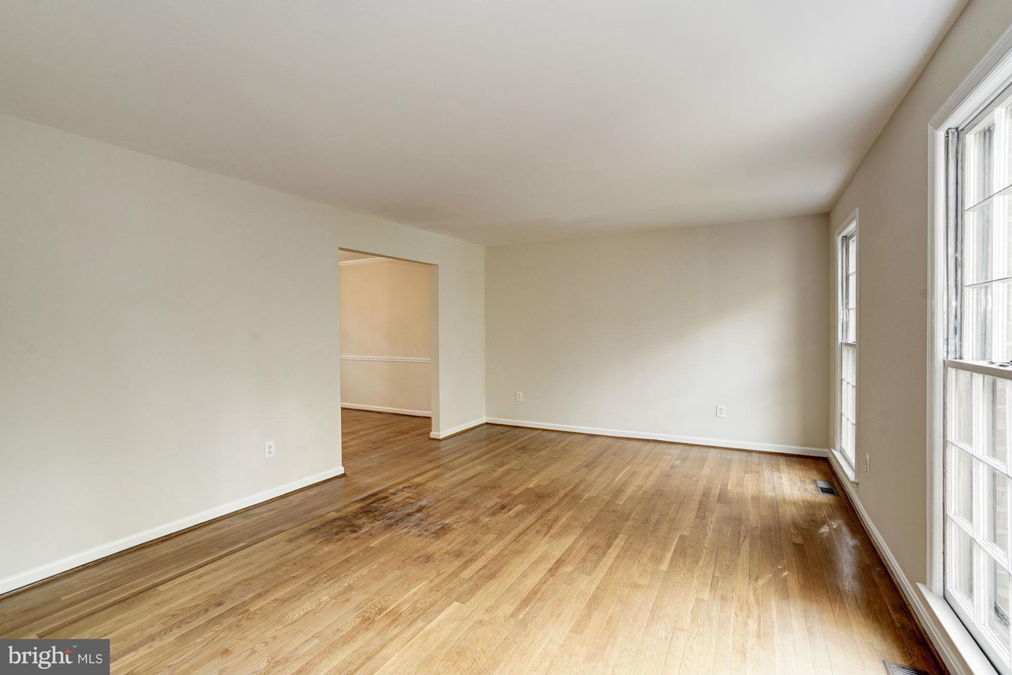 11037 Ring Road Reston, VA 20190 - Photo 8 of 30 an empty room with wooden floor and windows