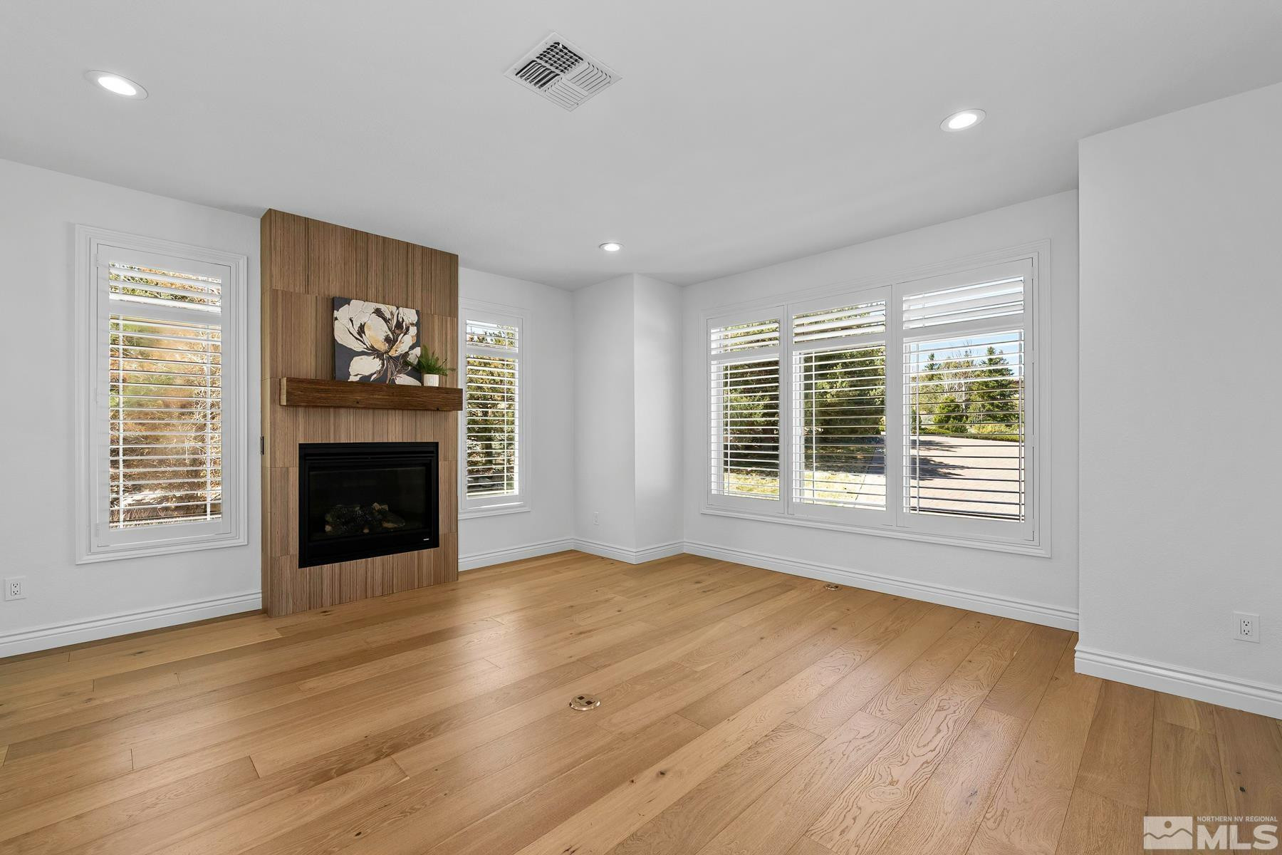13000 Silver Wolf Road Reno, NV 89511 - Photo 9 of 43 a view of an empty room with a window and fireplace