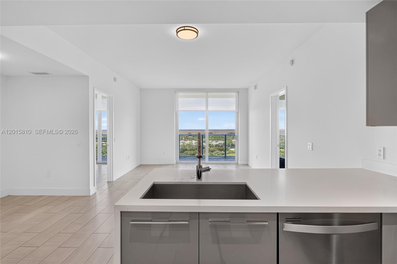 2000 Metropica Way, Unit 1902 Sunrise, FL 33323 - Photo 8 of 40 a kitchen with a sink and a window