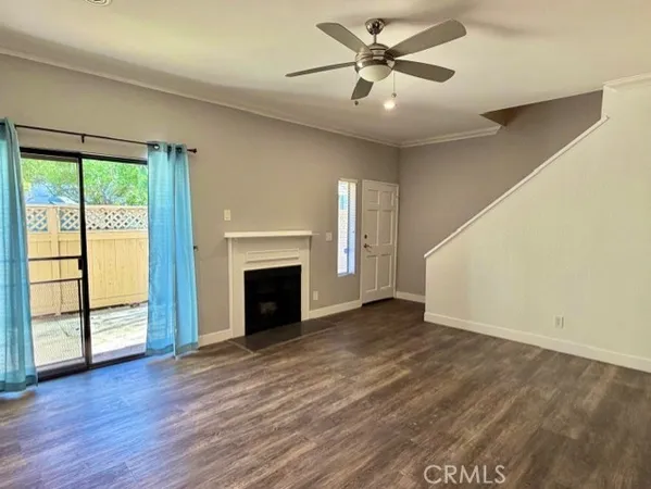 wooden floor in an empty room with a fireplace