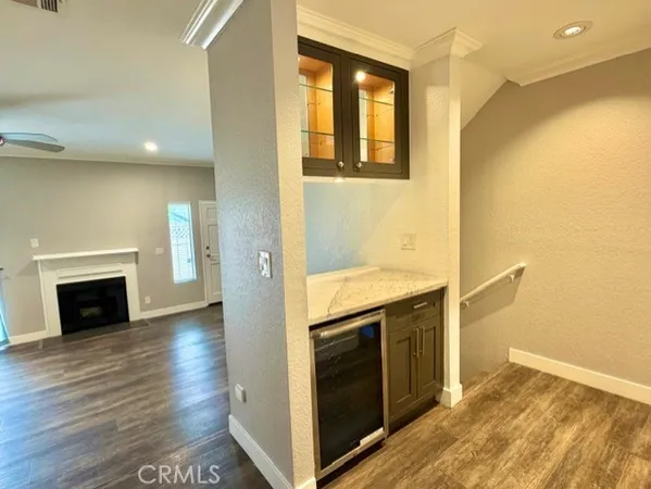 a view of a kitchen with a sink and a fireplace