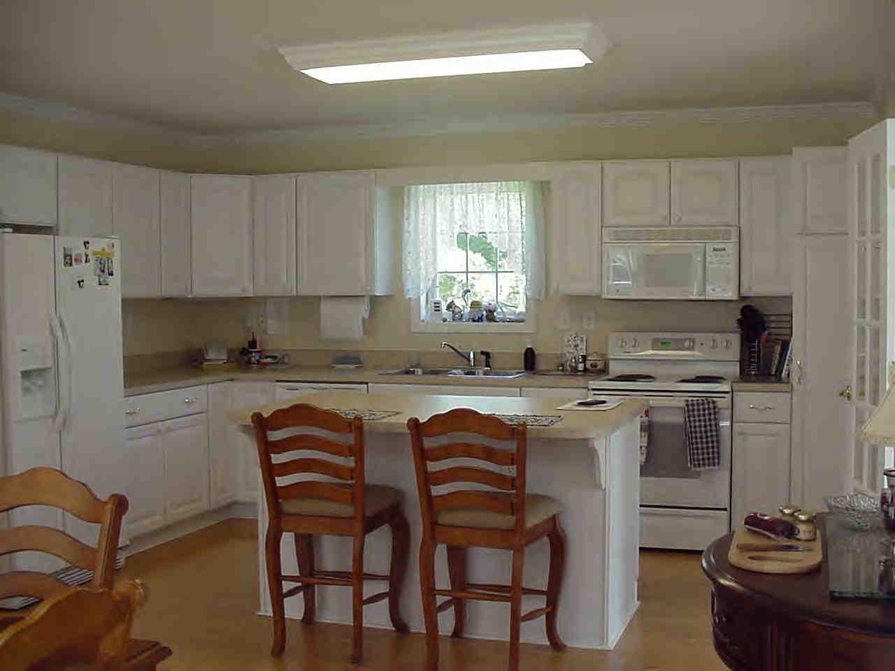 18 Smith Road West Stockbridge, MA 01266 - Photo 2 of 7 a kitchen with stainless steel appliances granite countertop a sink a stove a refrigerator dining table and chairs