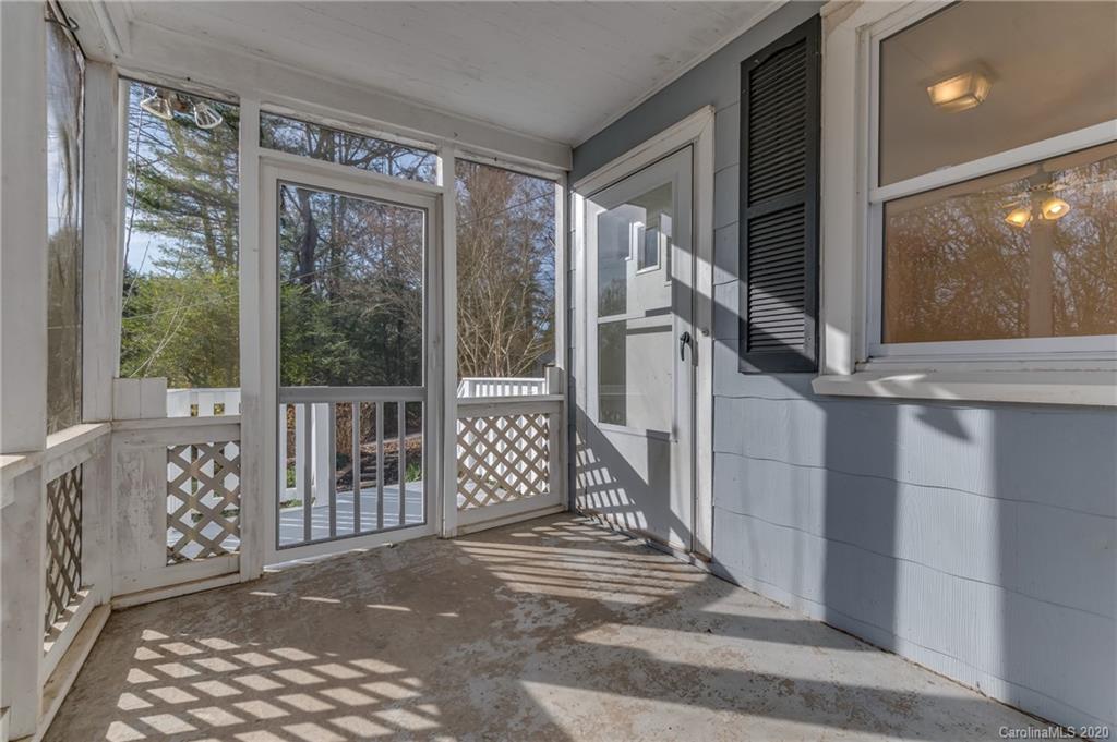 243 Woodland Road Tryon, NC 28782 - Photo 11 of 24 a view of a balcony with wooden floor and outdoor space