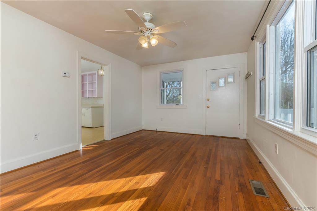 243 Woodland Road Tryon, NC 28782 - Photo 13 of 24 wooden floor in an empty room with a window