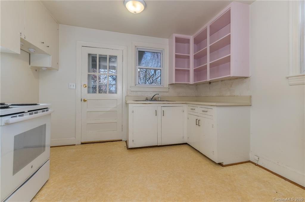 243 Woodland Road Tryon, NC 28782 - Photo 14 of 24 a kitchen with a cabinets and white appliances