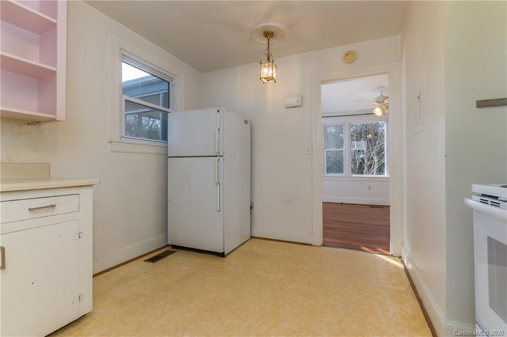 243 Woodland Road Tryon, NC 28782 - Photo 15 of 24 a view of an empty room with a kitchen