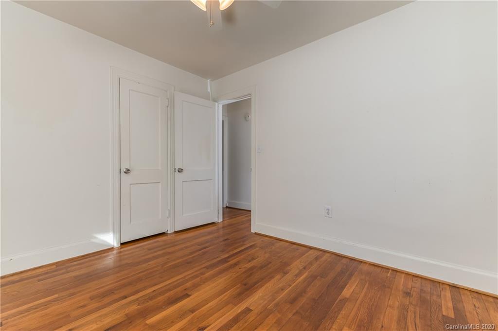 243 Woodland Road Tryon, NC 28782 - Photo 20 of 24 a view of an empty room with wooden floor