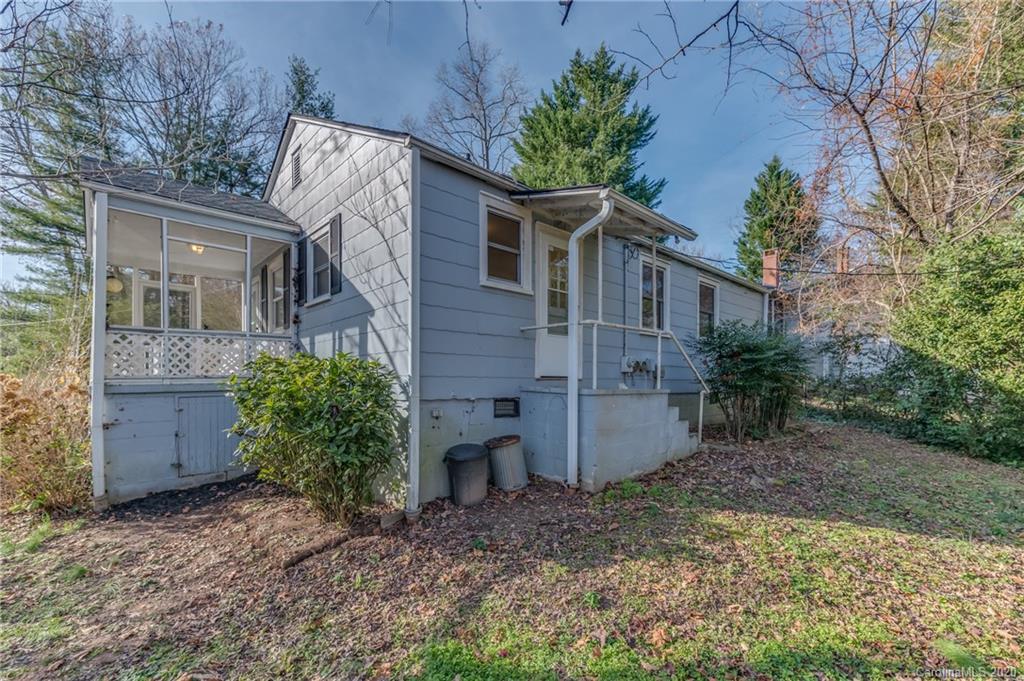 243 Woodland Road Tryon, NC 28782 - Photo 23 of 24 a view of a house with a yard