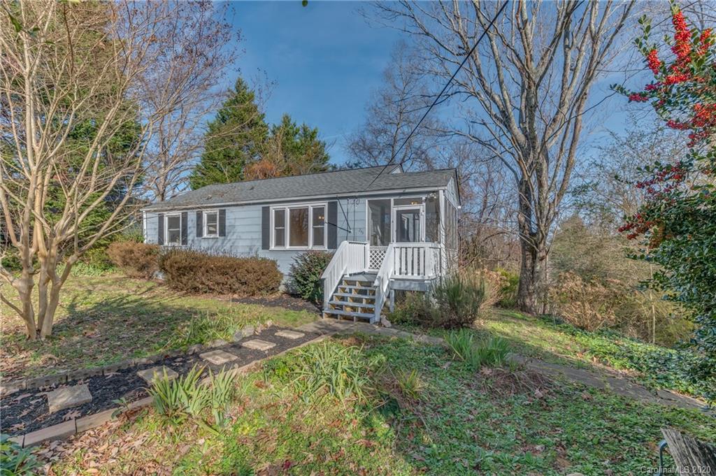 243 Woodland Road Tryon, NC 28782 - Photo 4 of 24 a house view with a garden space