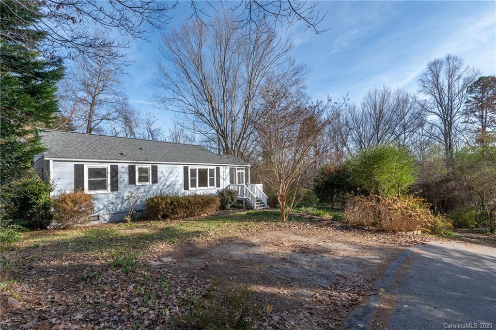 243 Woodland Road Tryon, NC 28782 - Photo 7 of 24 a view of a house with a yard