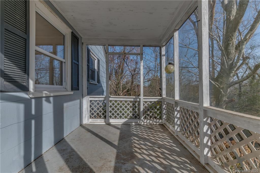 243 Woodland Road Tryon, NC 28782 - Photo 9 of 24 a view of a house with a large window