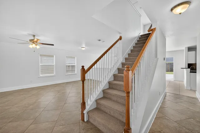 a view of staircase with white walls