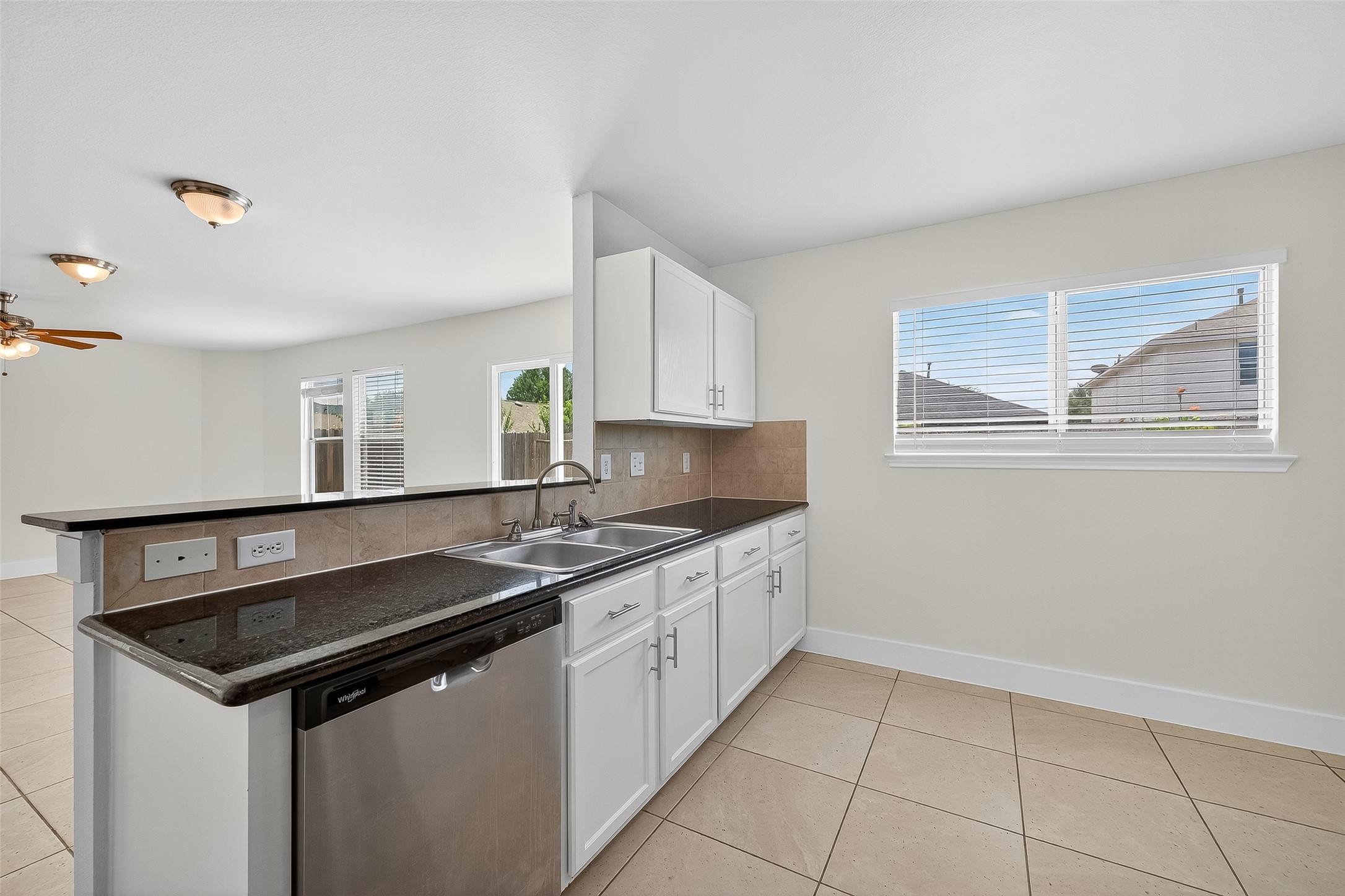 20907 Baronsledge Lane Katy, TX 77449 - Photo 21 of 50 a kitchen that has a sink and a stove