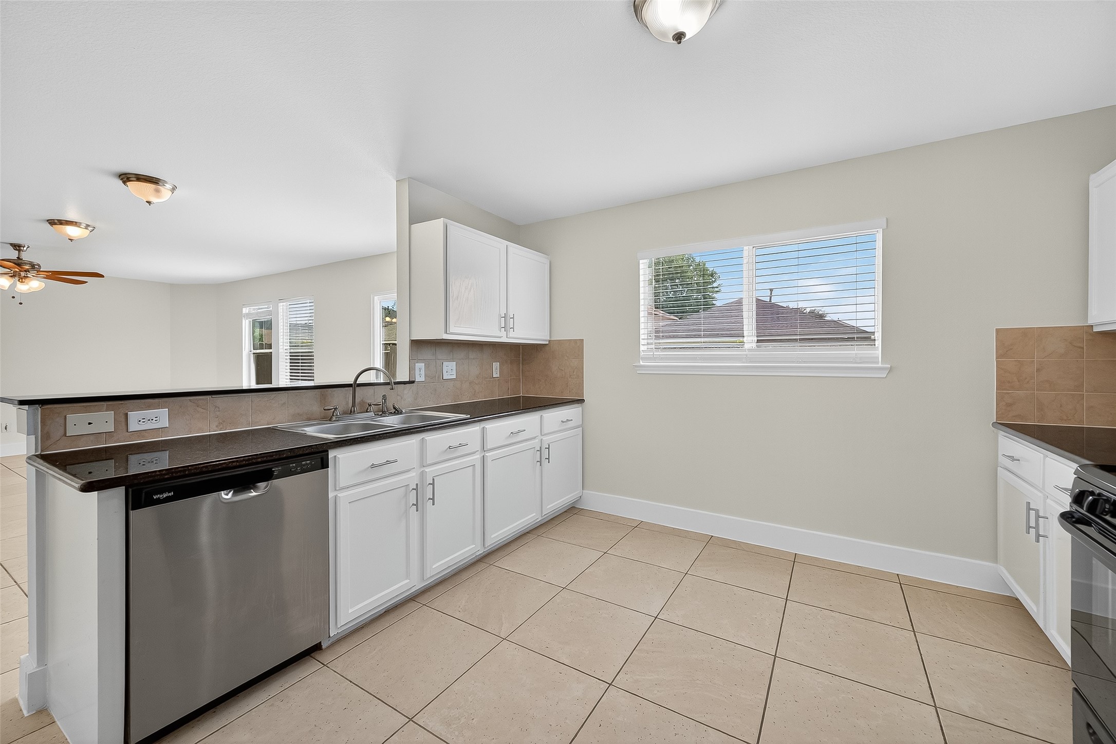 20907 Baronsledge Lane Katy, TX 77449 - Photo 24 of 50 a kitchen with stainless steel appliances granite countertop a sink and a stove