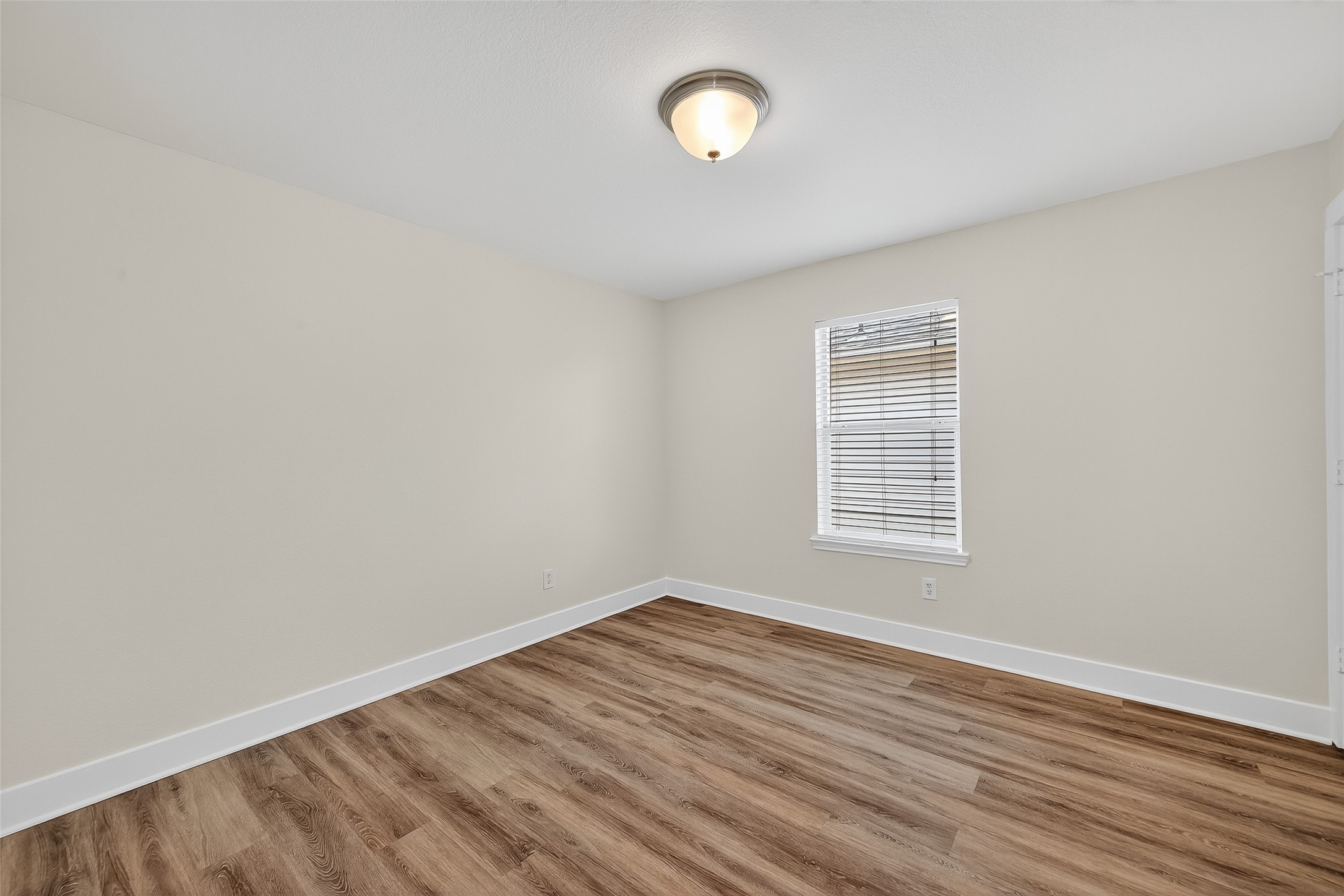 20907 Baronsledge Lane Katy, TX 77449 - Photo 29 of 50 an empty room with wooden floor and windows