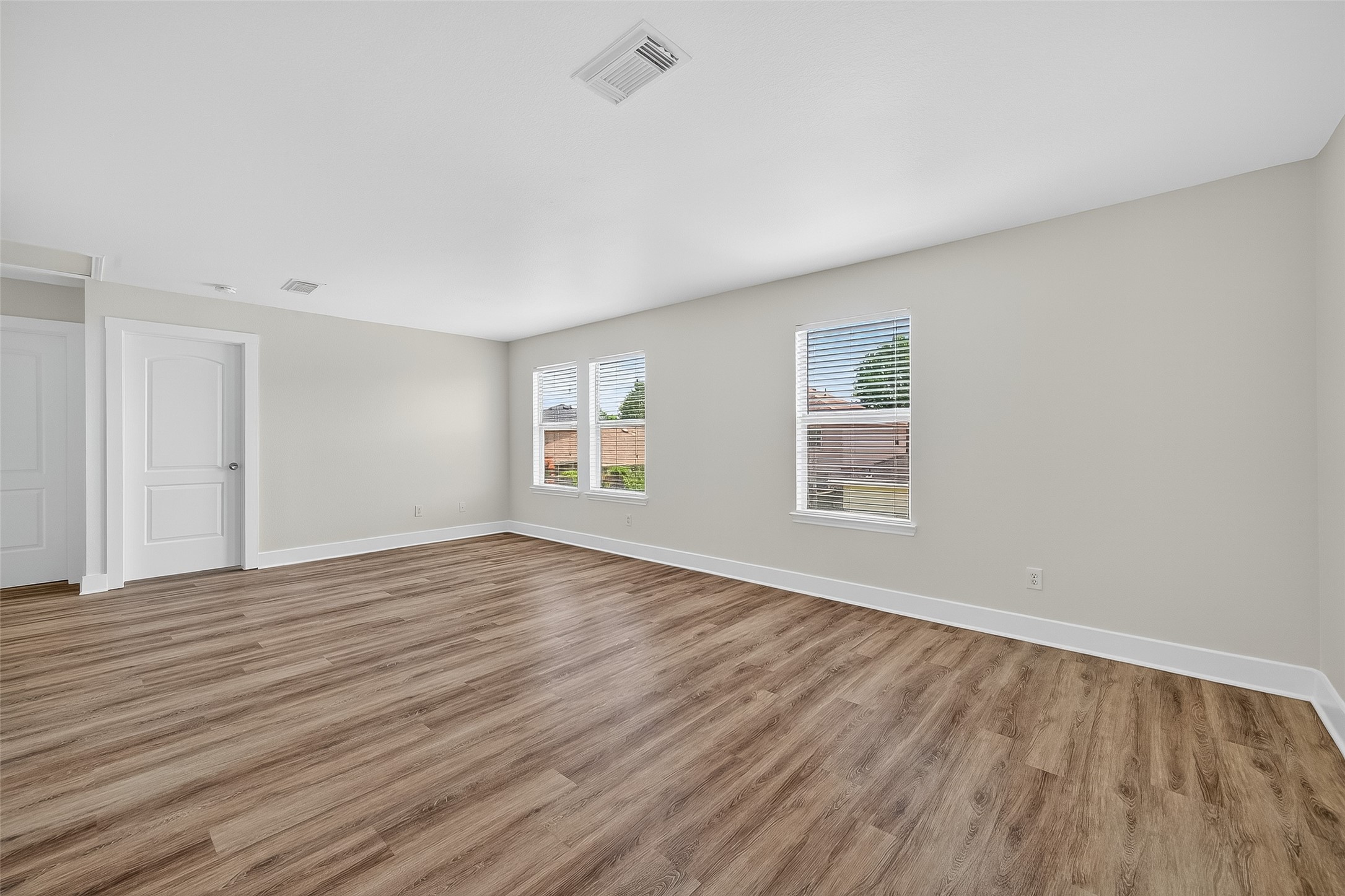20907 Baronsledge Lane Katy, TX 77449 - Photo 38 of 50 a view of an empty room with wooden floor and a window