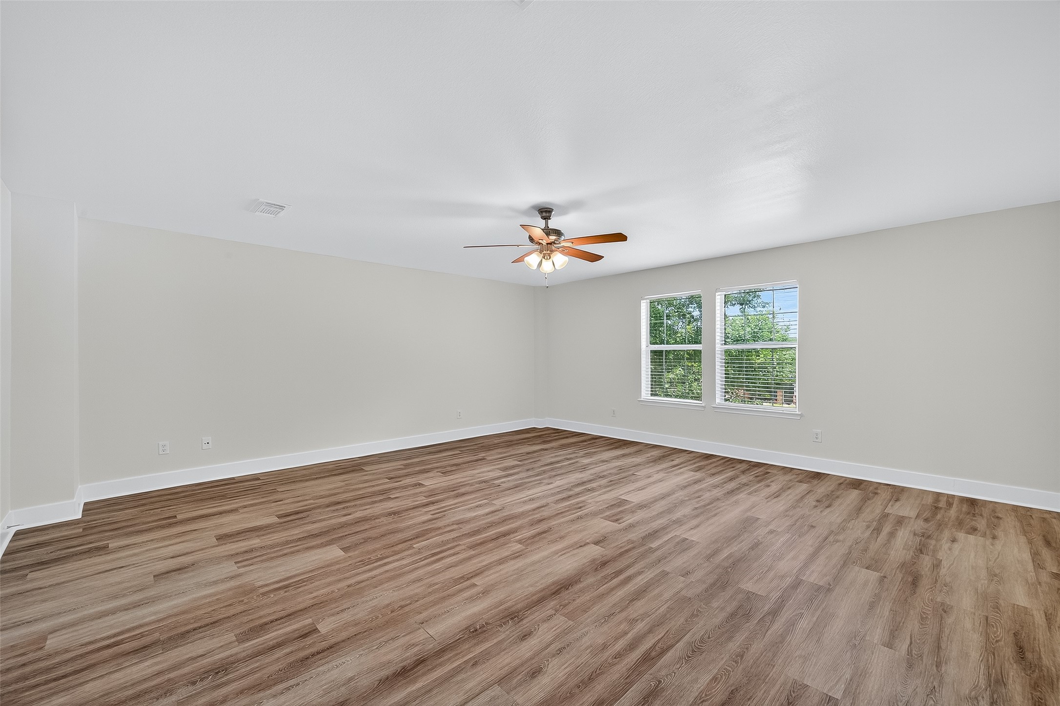 20907 Baronsledge Lane Katy, TX 77449 - Photo 39 of 50 wooden floor in an empty room with a window