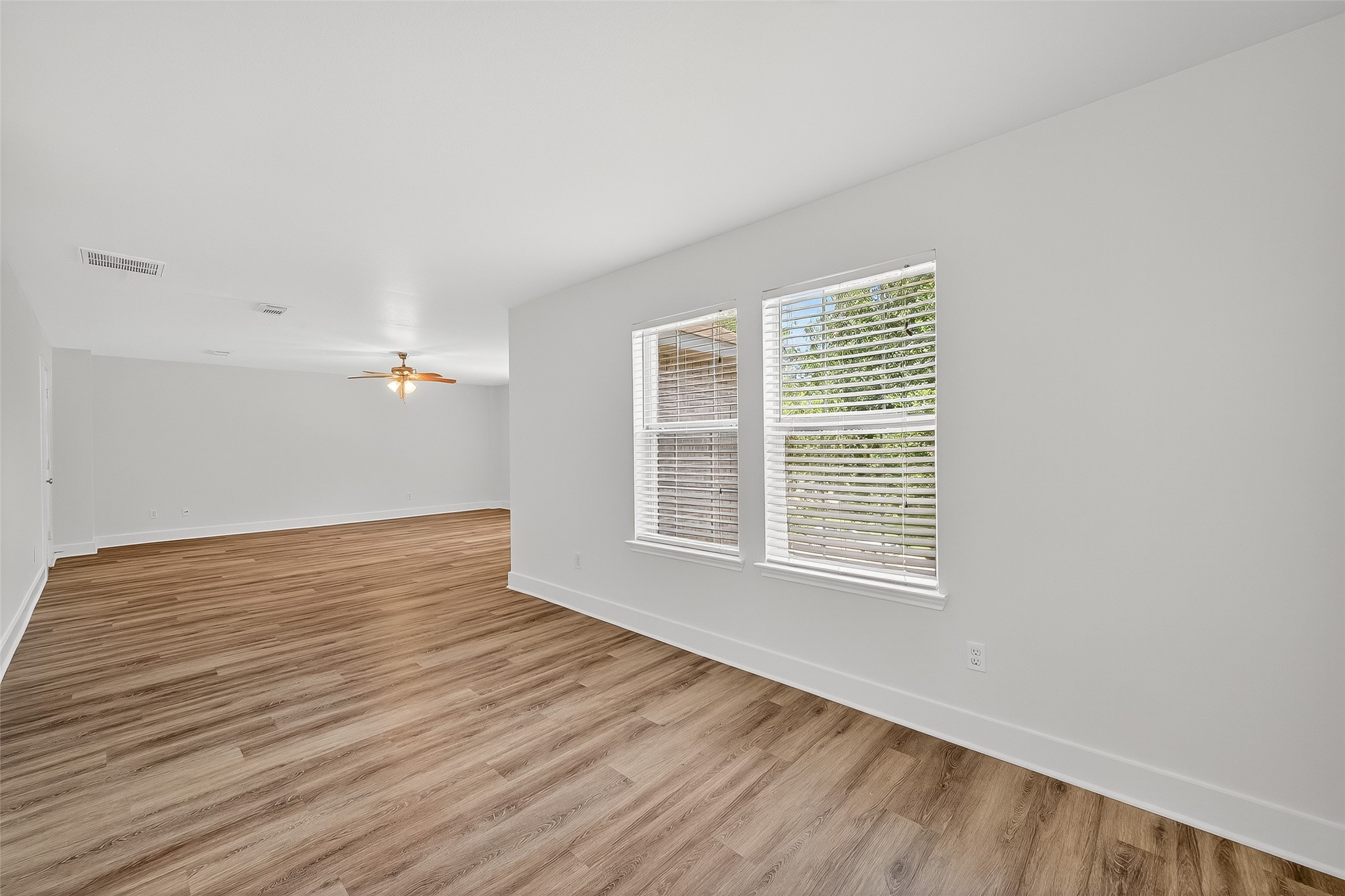 20907 Baronsledge Lane Katy, TX 77449 - Photo 40 of 50 a view of an empty room with wooden floor and a window