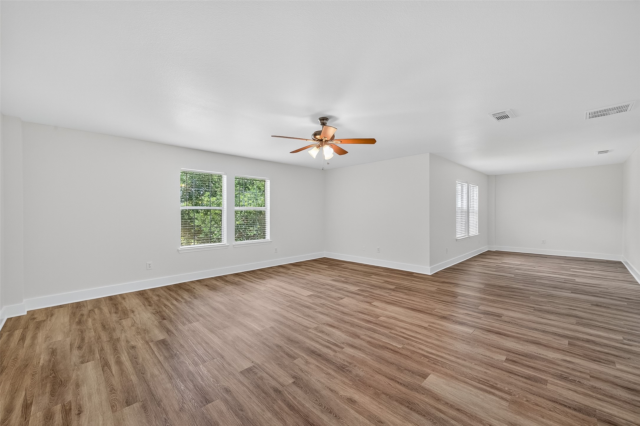 20907 Baronsledge Lane Katy, TX 77449 - Photo 44 of 50 wooden floor in an empty room with a window