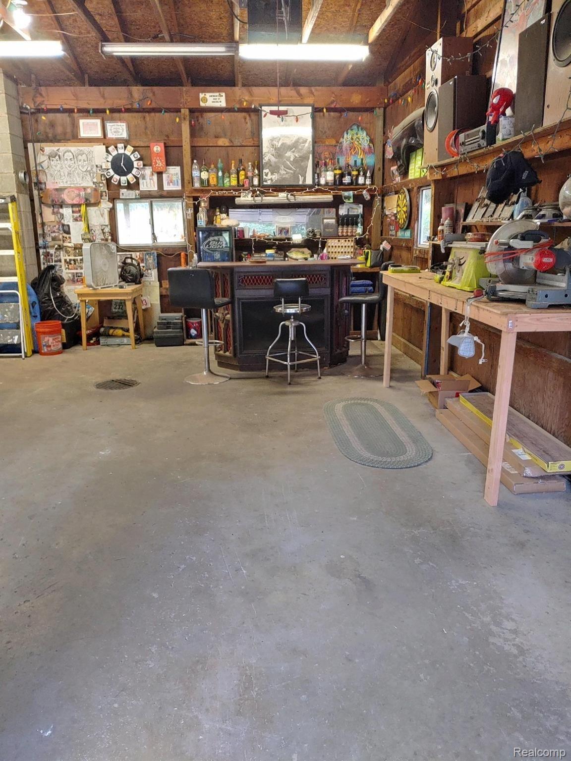 12542 Earl Road Stockbridge, MI 49285 - Photo 17 of 22 Room for cars and a man cave!