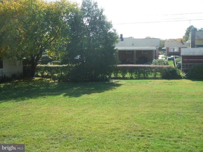4113 Kahlston Road Nottingham, MD 21236 - Photo 4 of 16 a view of a house with a big yard and potted plants