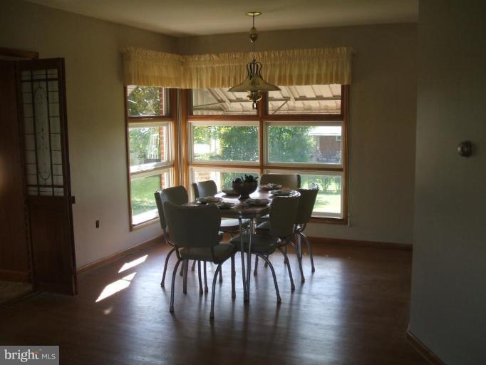 4113 Kahlston Road Nottingham, MD 21236 - Photo 8 of 16 a view of a dining room with furniture window and wooden floor