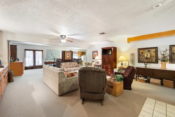 a view of a livingroom with furniture and a window