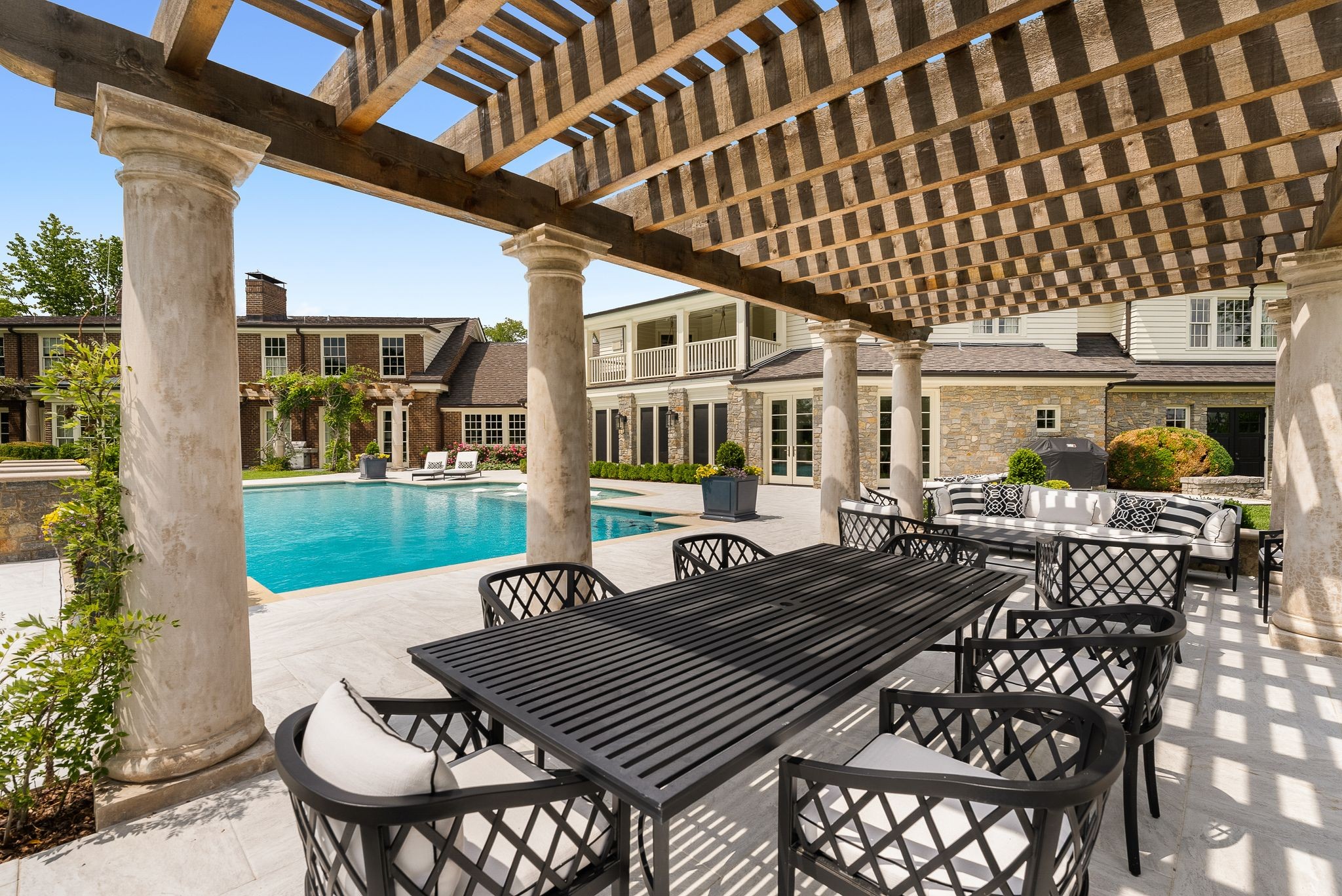 1577 Moran Road Franklin, TN 37069 - Photo 16 of 70 a view of a patio with table and chairs and potted plants