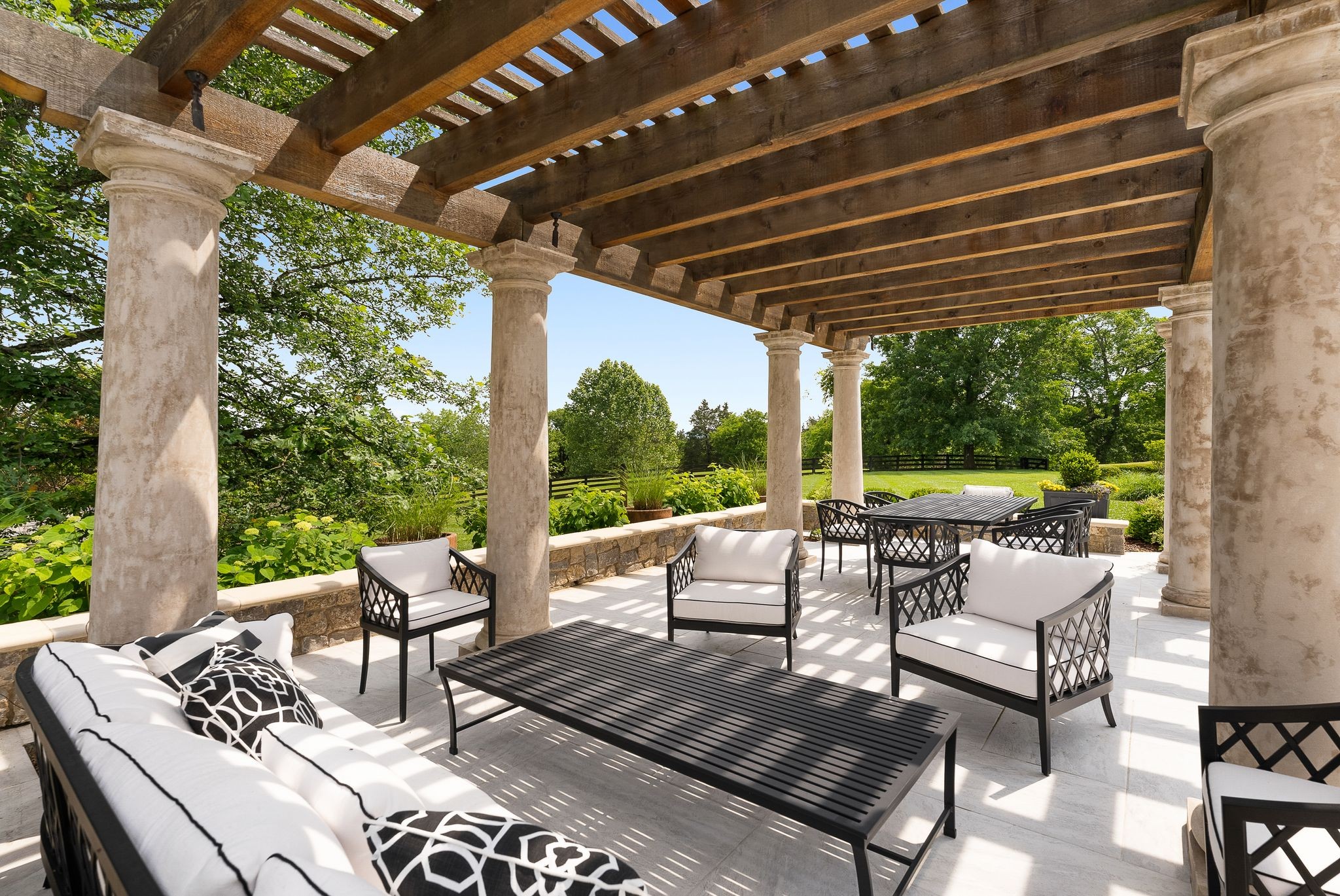 1577 Moran Road Franklin, TN 37069 - Photo 17 of 70 a view of patio with couches chairs and wooden fence