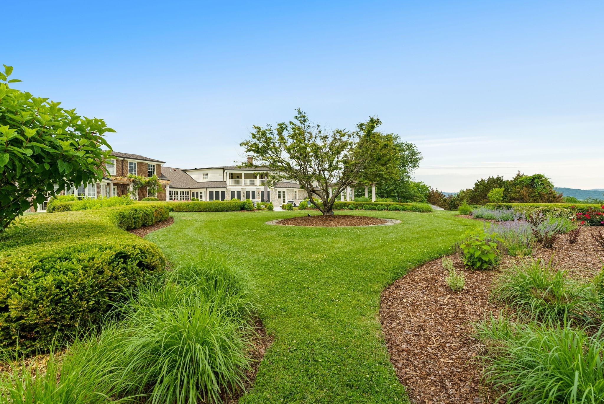 1577 Moran Road Franklin, TN 37069 - Photo 21 of 70 a view of a garden with a building in the background