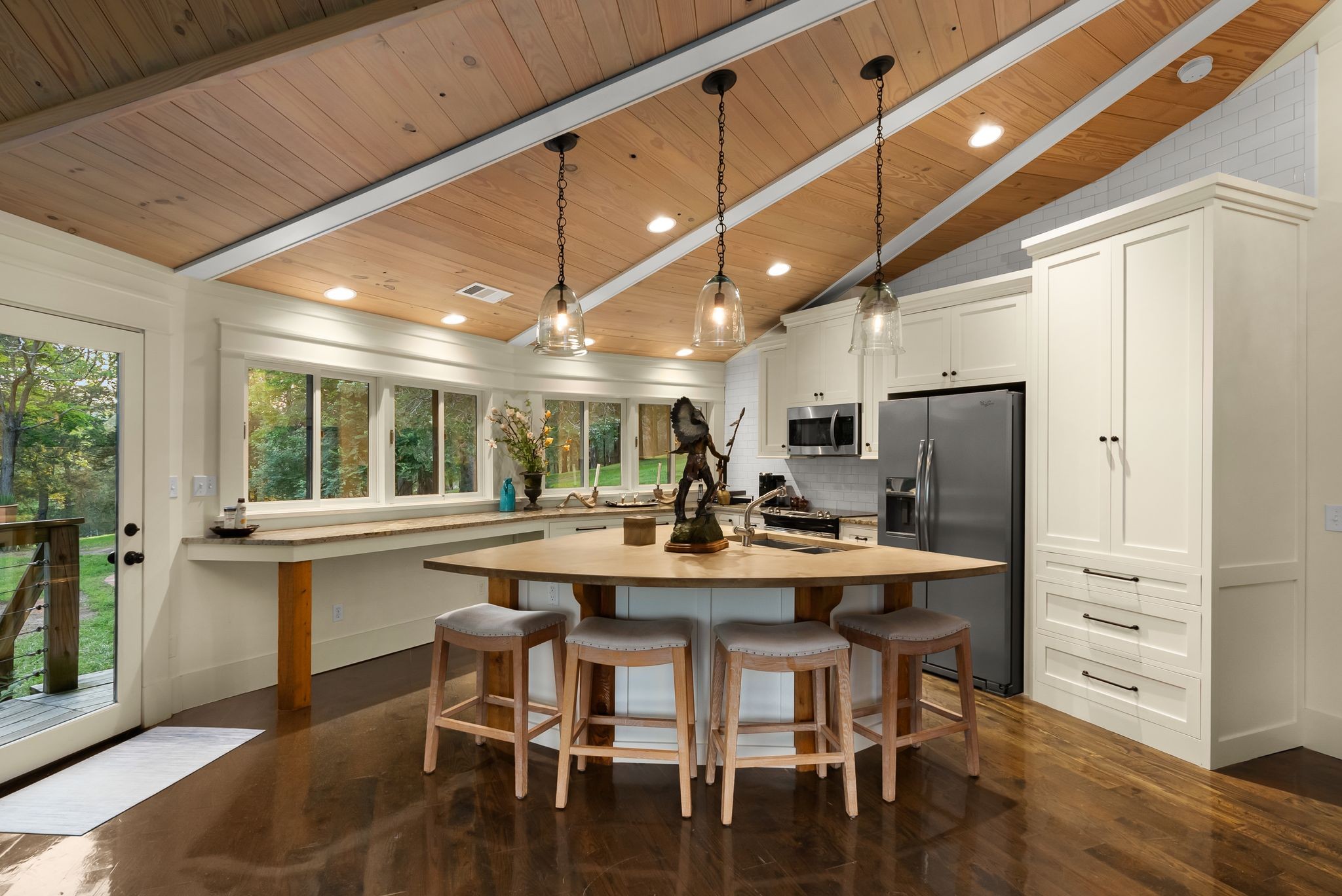 1577 Moran Road Franklin, TN 37069 - Photo 66 of 70 a kitchen with stainless steel appliances kitchen island granite countertop a table chairs sink and cabinets