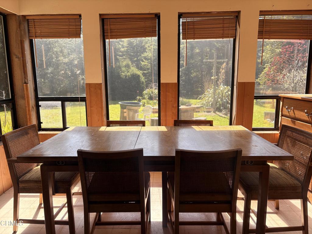 32271 Albion Ridge Road Albion, CA 95410 - Photo 2 of 3 a dining room with a table chairs and a window