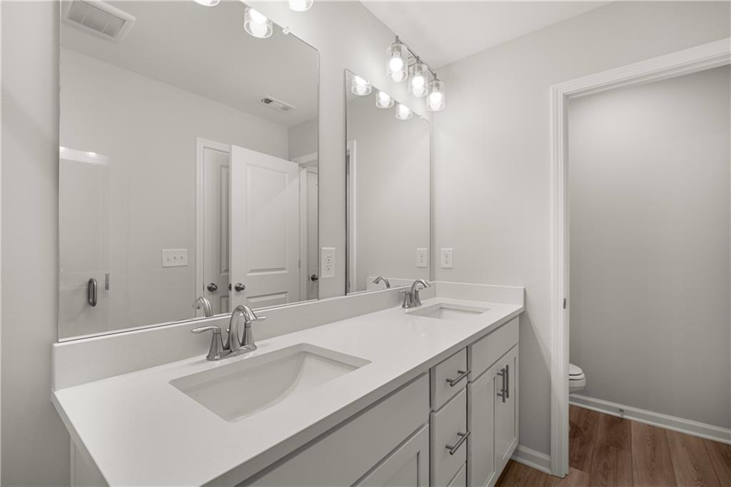 117 Pk Rdg Circle Emerson, GA 30120 - Photo 47 of 49 a bathroom with a sink double vanity and a mirror