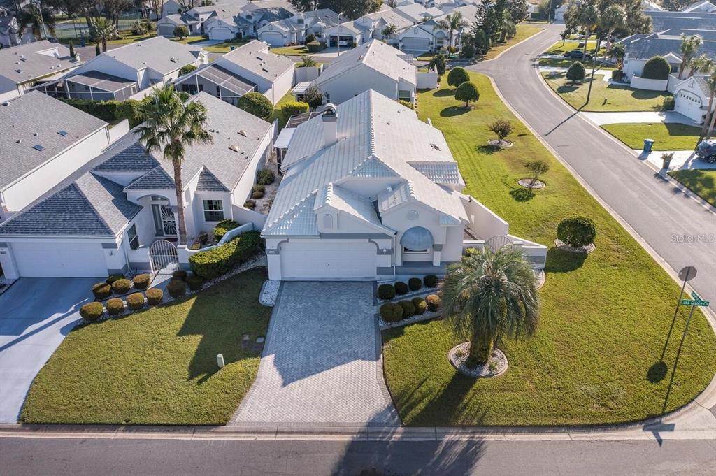 an aerial view of a house with a swimming pool