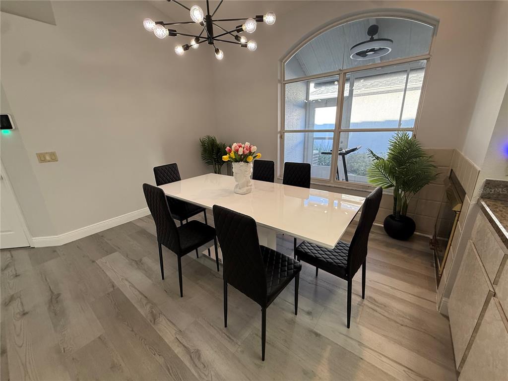 10400 Casa Grande Circle Spring Hill, FL 34608 - Photo 12 of 55 a view of a dining room with furniture and window