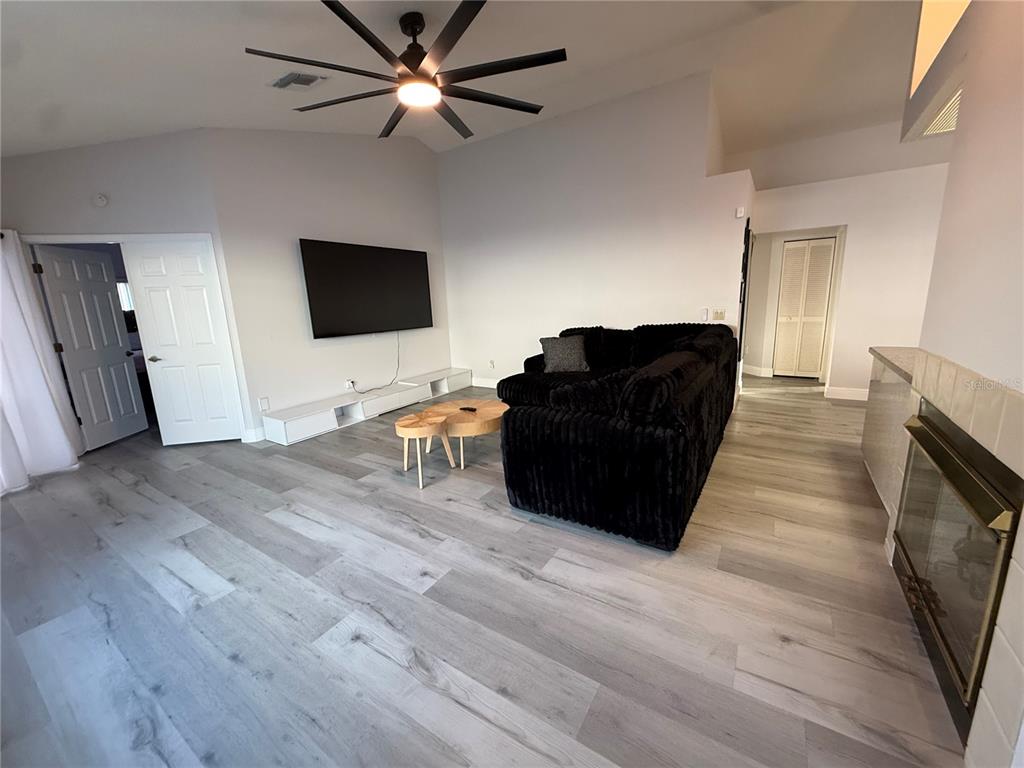10400 Casa Grande Circle Spring Hill, FL 34608 - Photo 16 of 55 a living room with furniture and a flat screen tv