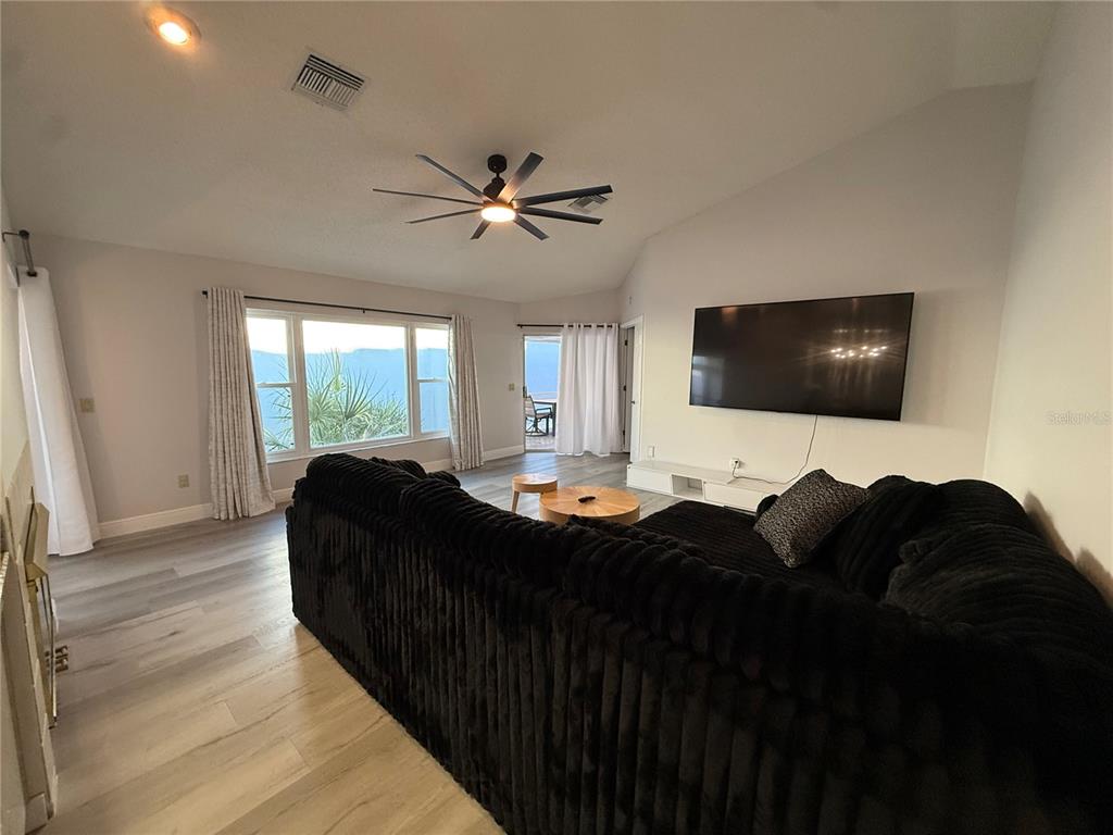 10400 Casa Grande Circle Spring Hill, FL 34608 - Photo 17 of 55 a living room with furniture and a flat screen tv