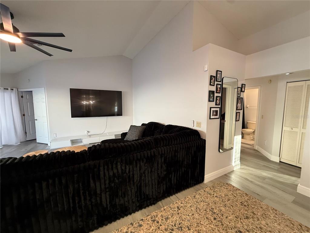 10400 Casa Grande Circle Spring Hill, FL 34608 - Photo 18 of 55 a living room with a couch and a flat screen tv