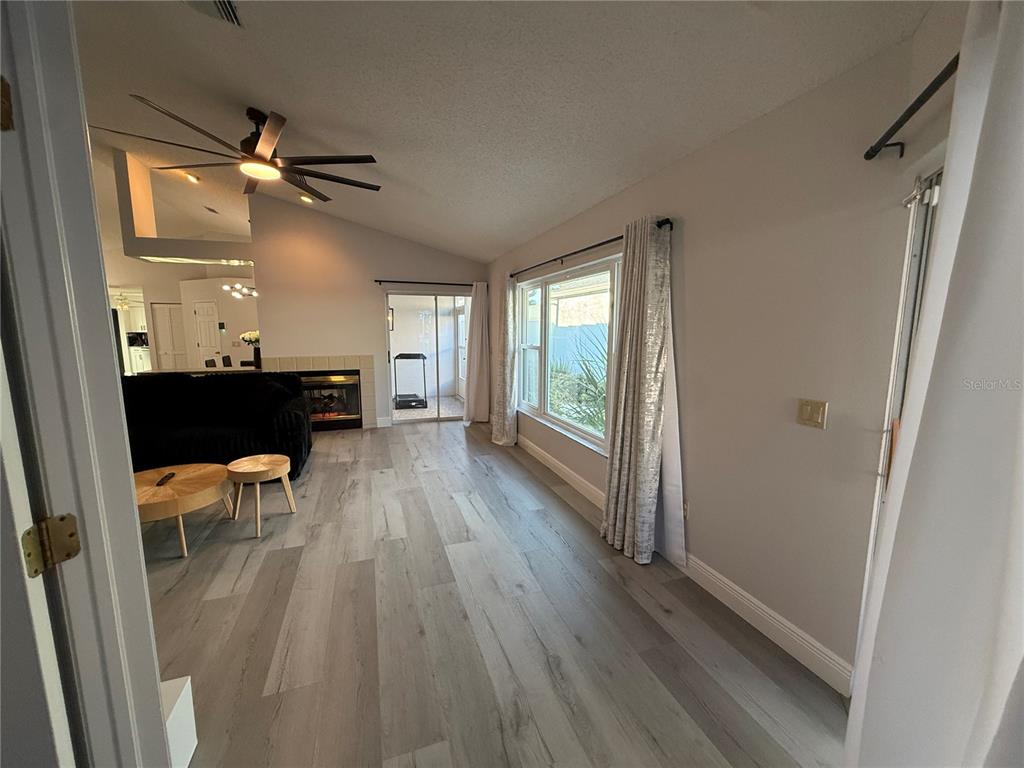 10400 Casa Grande Circle Spring Hill, FL 34608 - Photo 20 of 55 a view of a hallway view with wooden floor and furniture