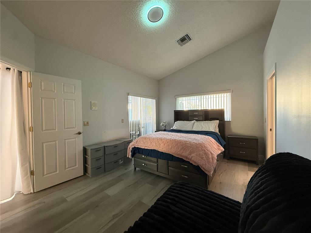 10400 Casa Grande Circle Spring Hill, FL 34608 - Photo 21 of 55 a bedroom with a bed and a window