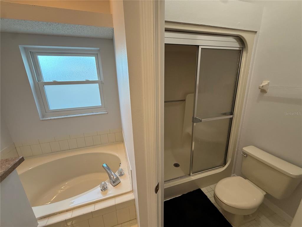 10400 Casa Grande Circle Spring Hill, FL 34608 - Photo 26 of 55 a bathroom with a toilet and a bathtub