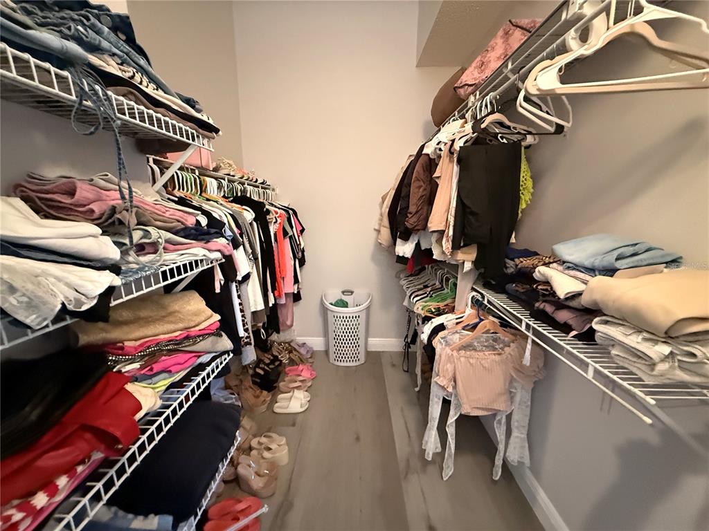 10400 Casa Grande Circle Spring Hill, FL 34608 - Photo 27 of 55 a view of walk in closet with clothes and shoes