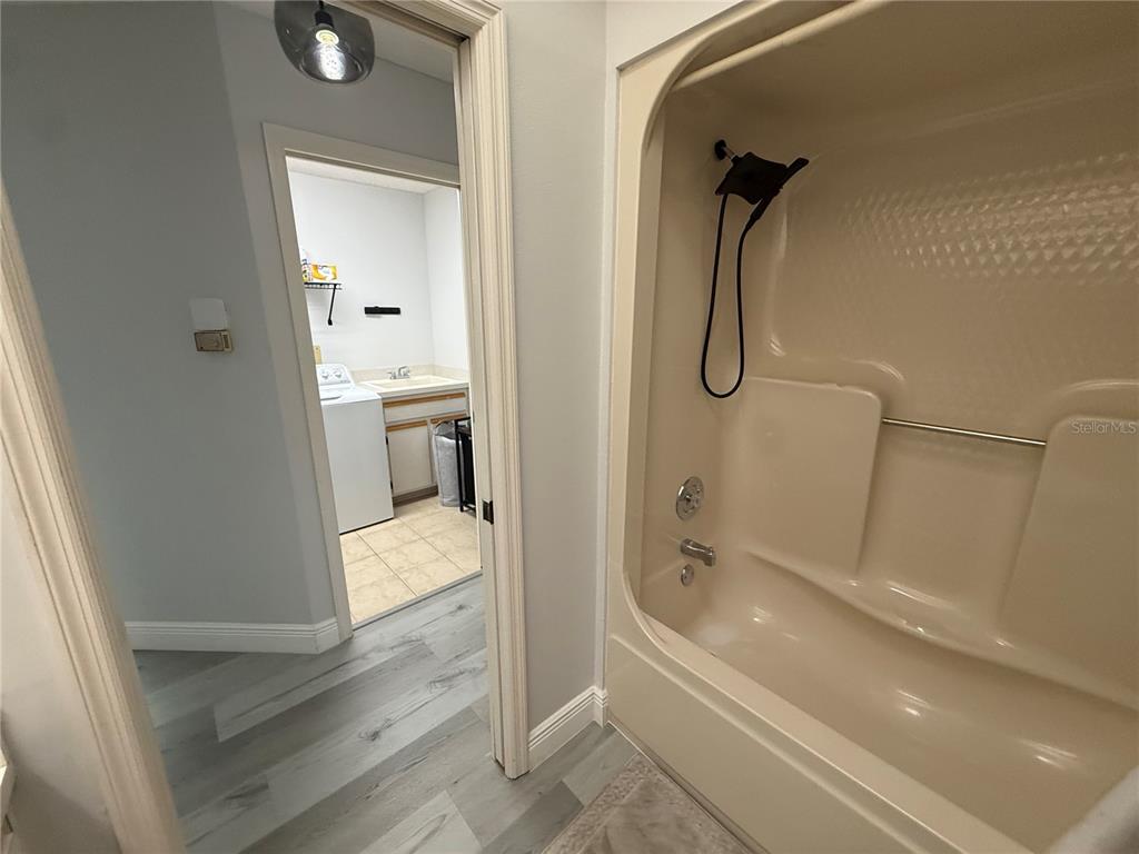 10400 Casa Grande Circle Spring Hill, FL 34608 - Photo 30 of 55 a bathroom with a bathtub and a shower