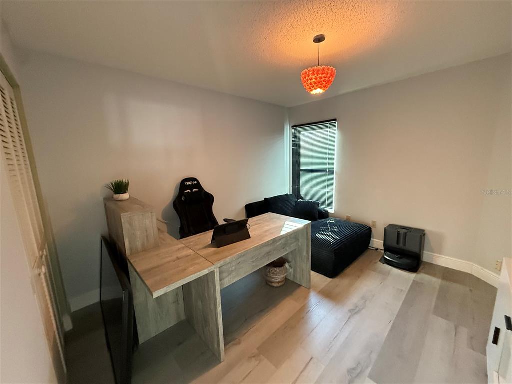 10400 Casa Grande Circle Spring Hill, FL 34608 - Photo 32 of 55 a view of a workspace with furniture and a window