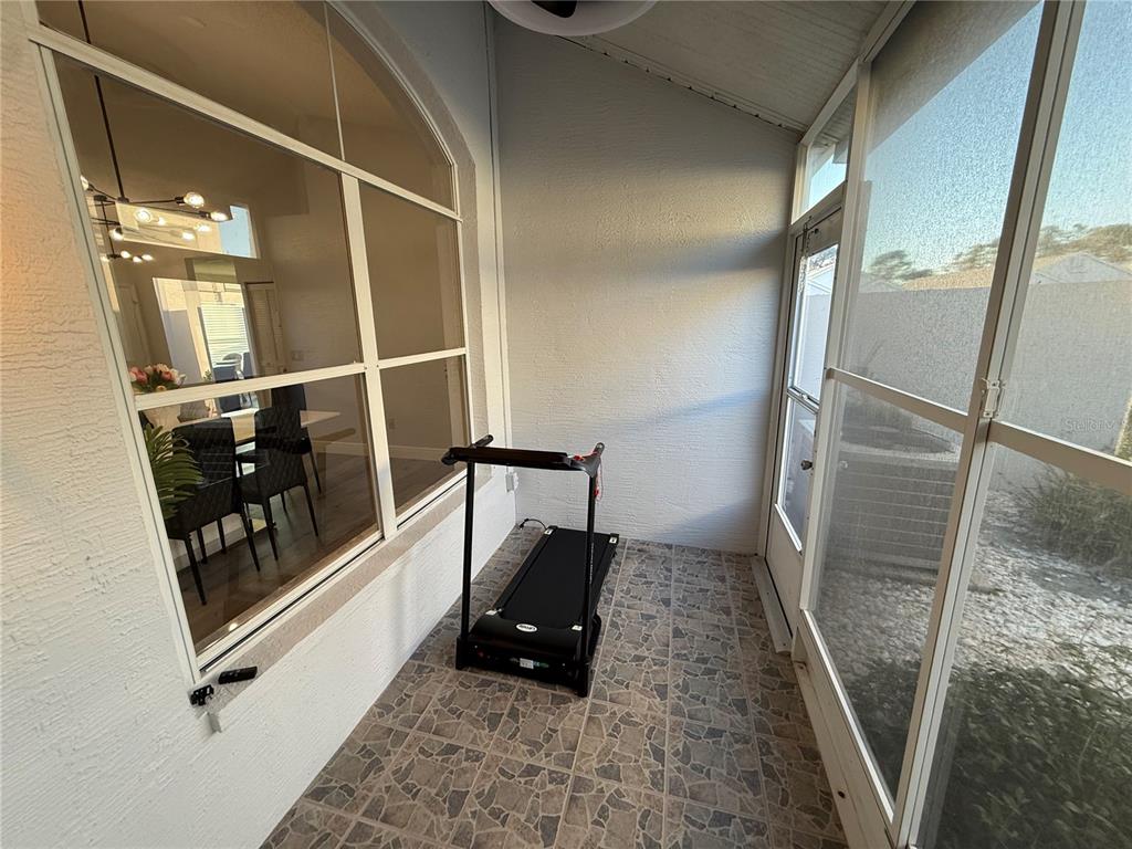 10400 Casa Grande Circle Spring Hill, FL 34608 - Photo 47 of 55 a living room with walk in closet and wooden floor
