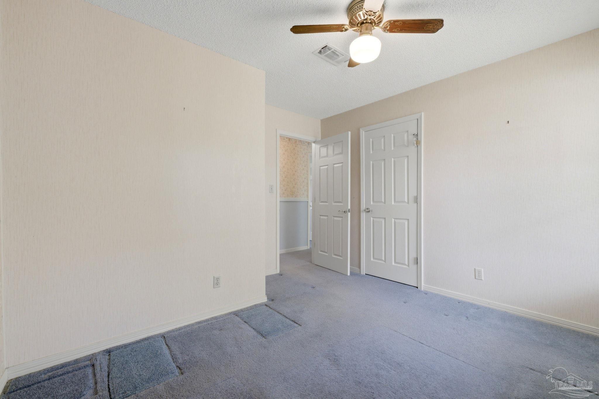 4320 Grant Street Pace, FL 32571 - Photo 17 of 27 an empty room with chandelier fan