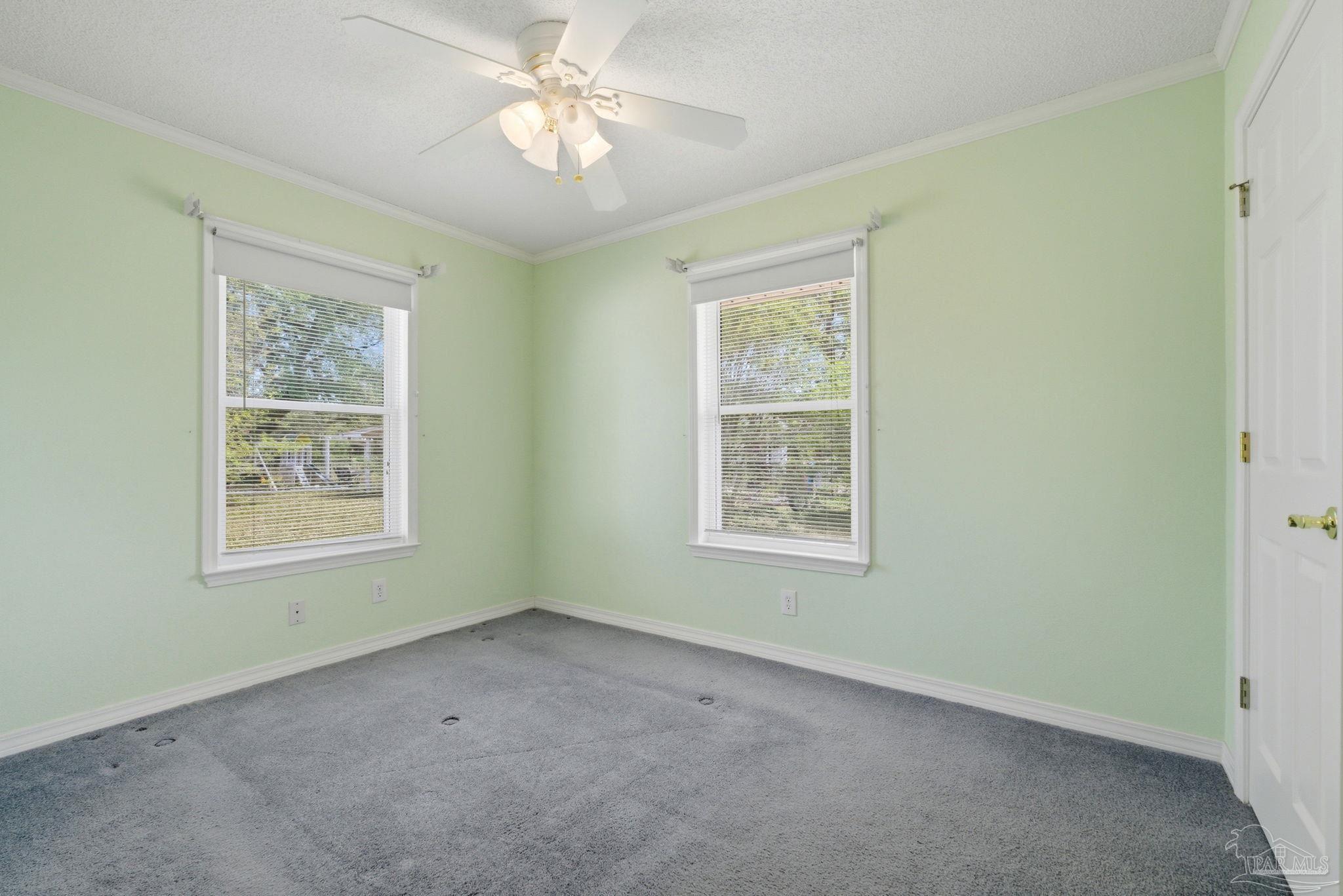 4320 Grant Street Pace, FL 32571 - Photo 18 of 27 a view of an empty room with a window