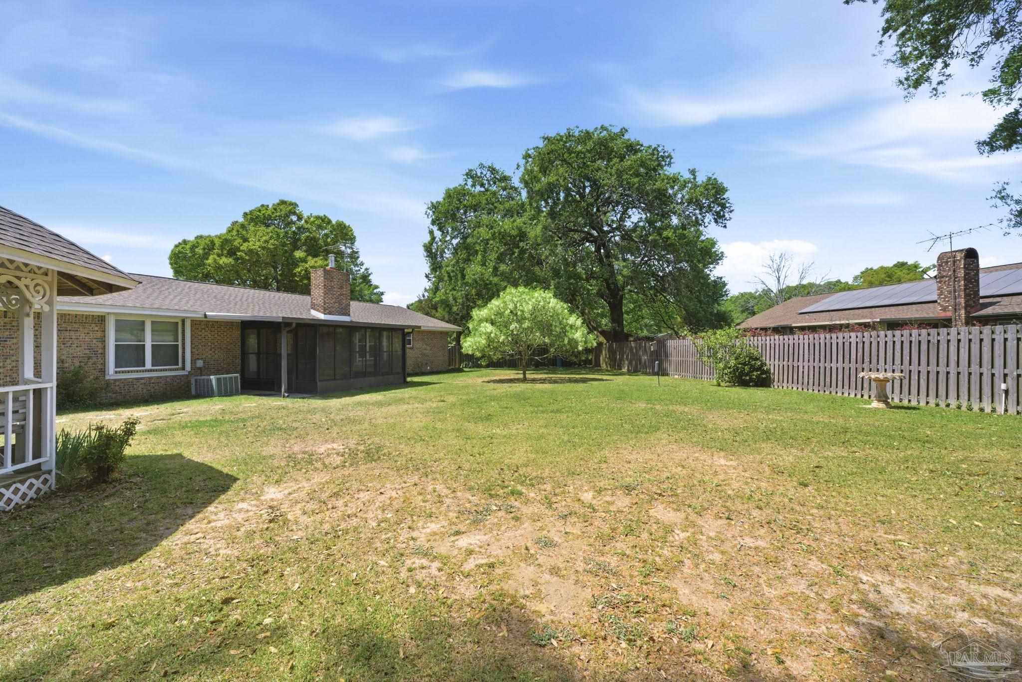 4320 Grant Street Pace, FL 32571 - Photo 25 of 27 a backyard of a house