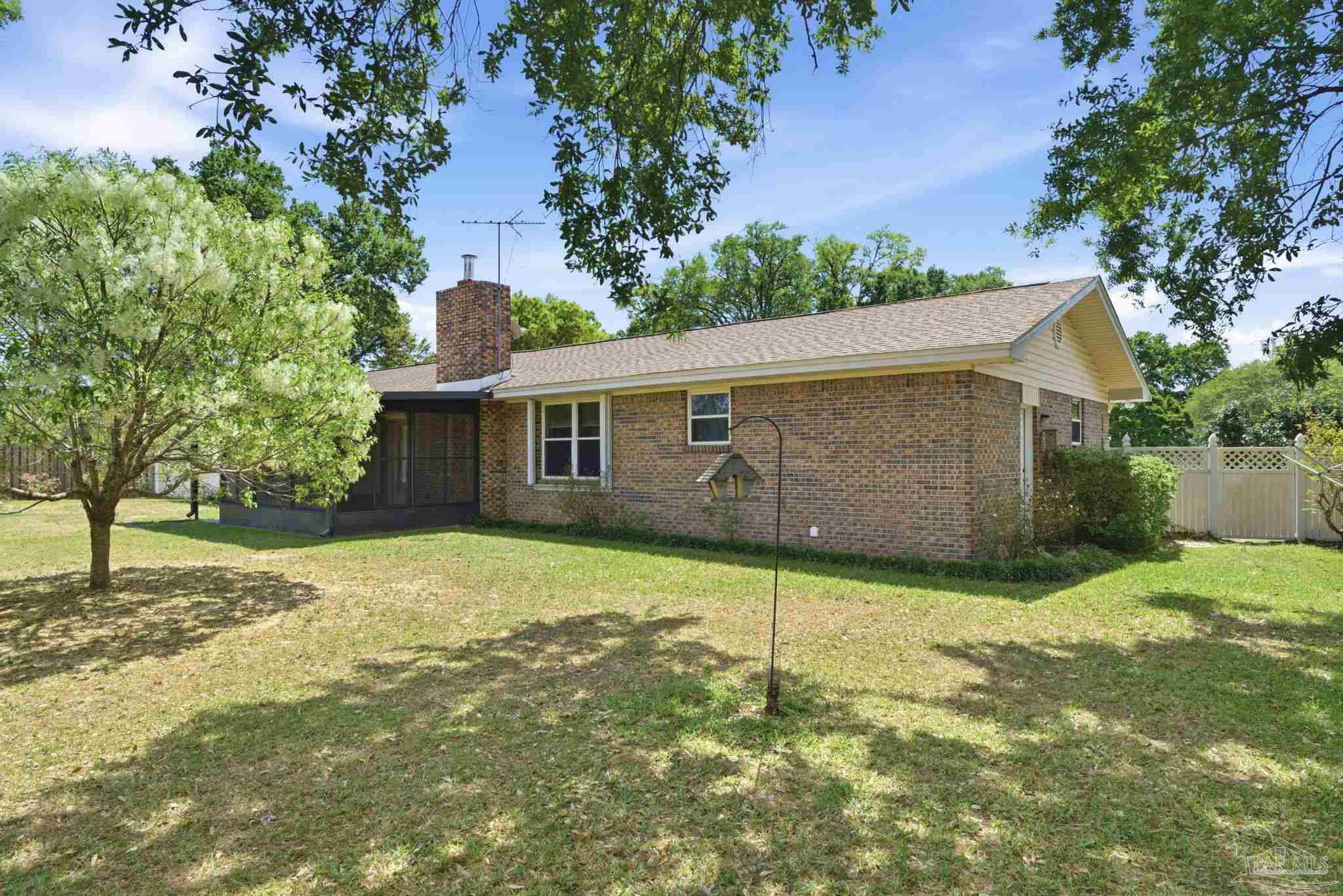 4320 Grant Street Pace, FL 32571 - Photo 27 of 27 a backyard of a house