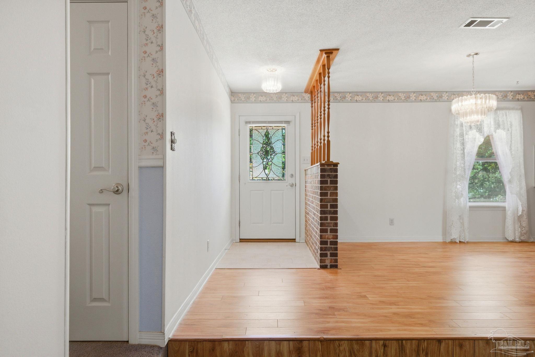 4320 Grant Street Pace, FL 32571 - Photo 3 of 27 a view of entryway with wooden floor